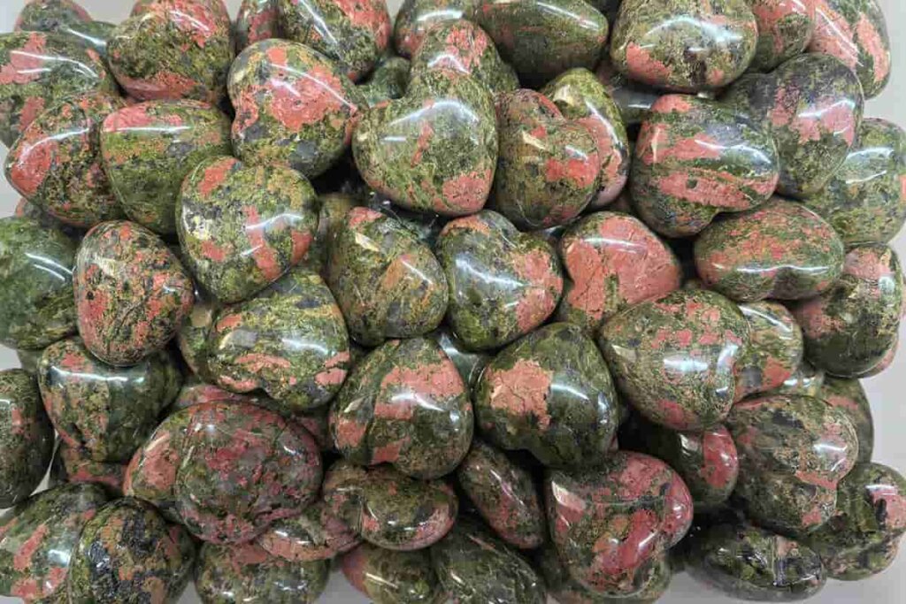 Natural Unakite Heart Stone with green and pink patterns, symbolizing emotional balance and grounding — Unakite Meaning focuses on healing and harmony.