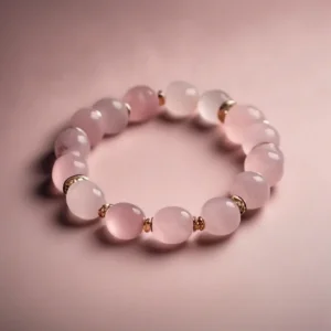 Single rose quartz bracelet on soft pink background – perfect for illustrating gentle style and core rose quartz bracelet benefits for the heart chakra.