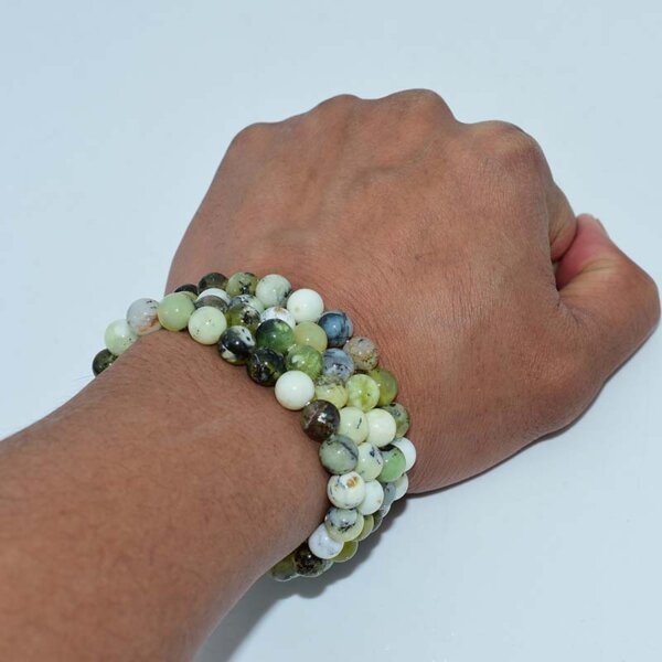 Green Opal Bracelets stacked on both wrists for styling