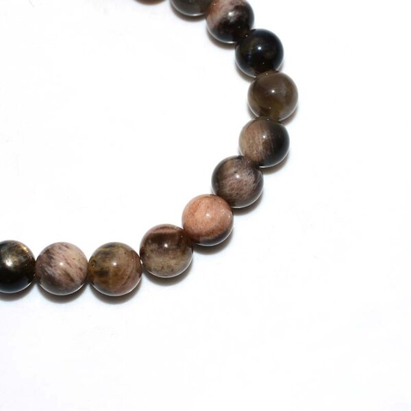 Close-up of Black Sunstone beads highlighting metallic sparkle