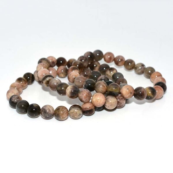 Multiple Black Sunstone Bracelets stacked together for display