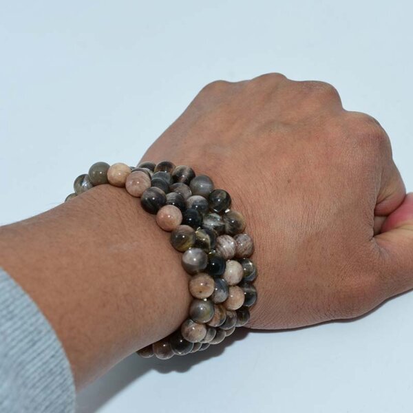 Black Sunstone Bracelet worn on wrist showcasing natural shimmer