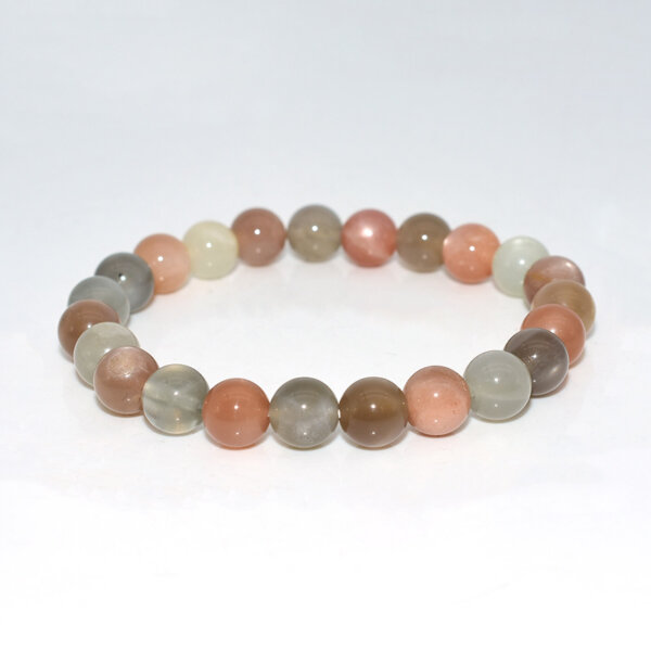 Close-up of Peach Moonstone Bracelet beads showing natural color mix and surface details