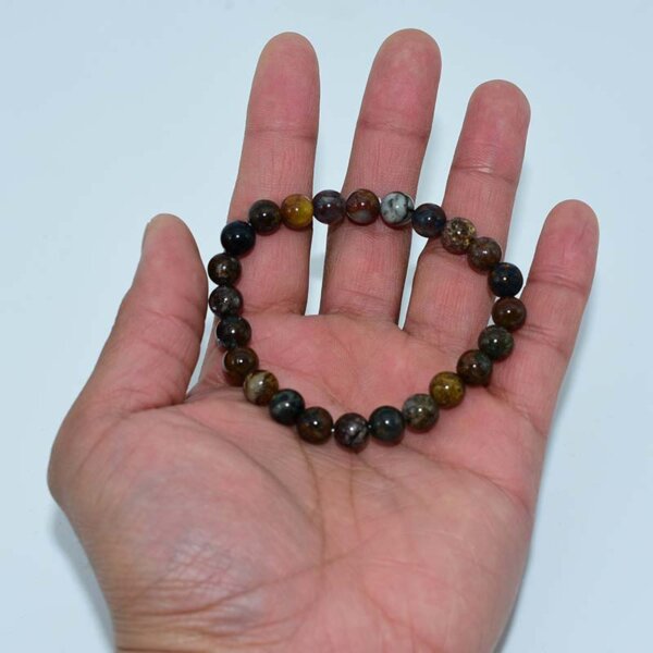 Pietersite Bracelet shown in hand to highlight bead size and texture