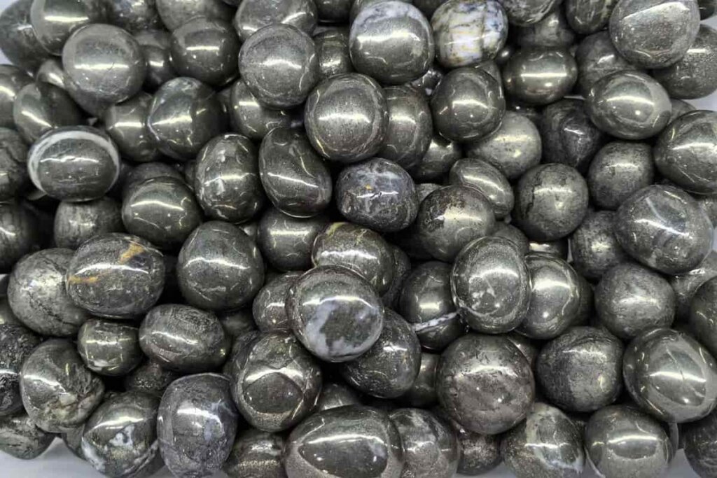 Pyrite tumbled stones 20–30mm, smooth and shiny—Pyrite Stone Benefits for pocket stones, gifting, and retail sets.