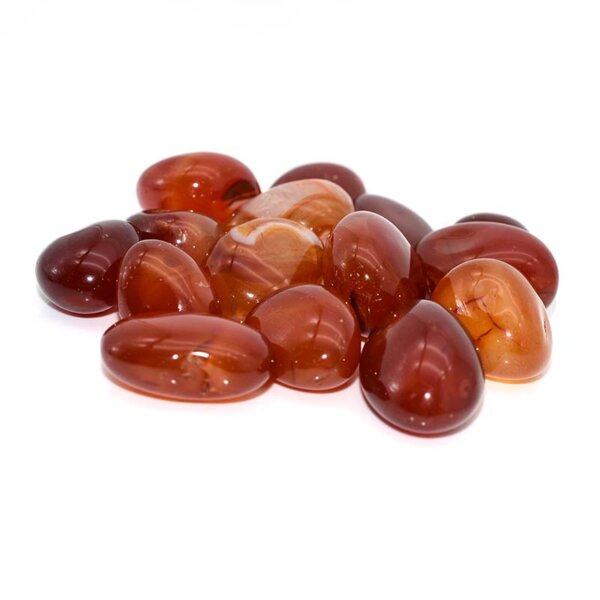 Pile of bright red Tumbled Carnelian stones for decoration or crystal healing