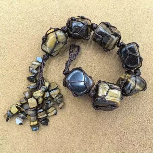 Angled view of Macrame Chakra Stones car or home hanging with chip tassel and macrame繩
