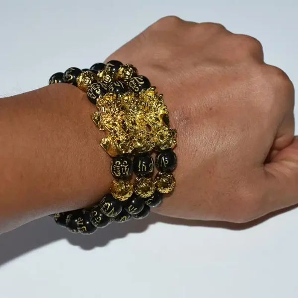 Close-up of Feng Shui Obsidian Bracelet on hand