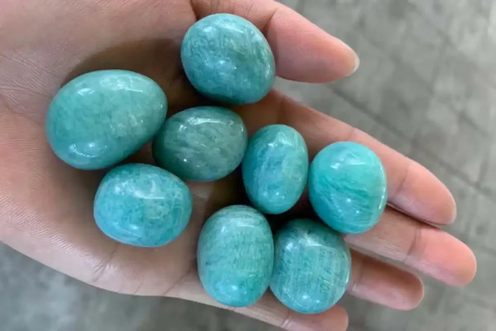 Amazonite Bracelet Benefits – tumbled amazonite stone 2–3 cm held on hand