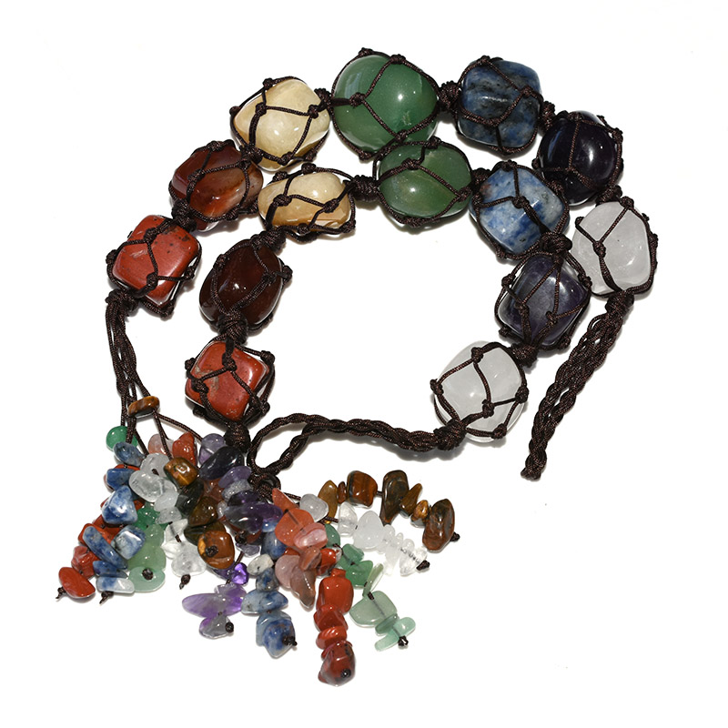 Macrame Chakra Stones arranged in a circle, macrame绳 net holding seven chakra crystals securely