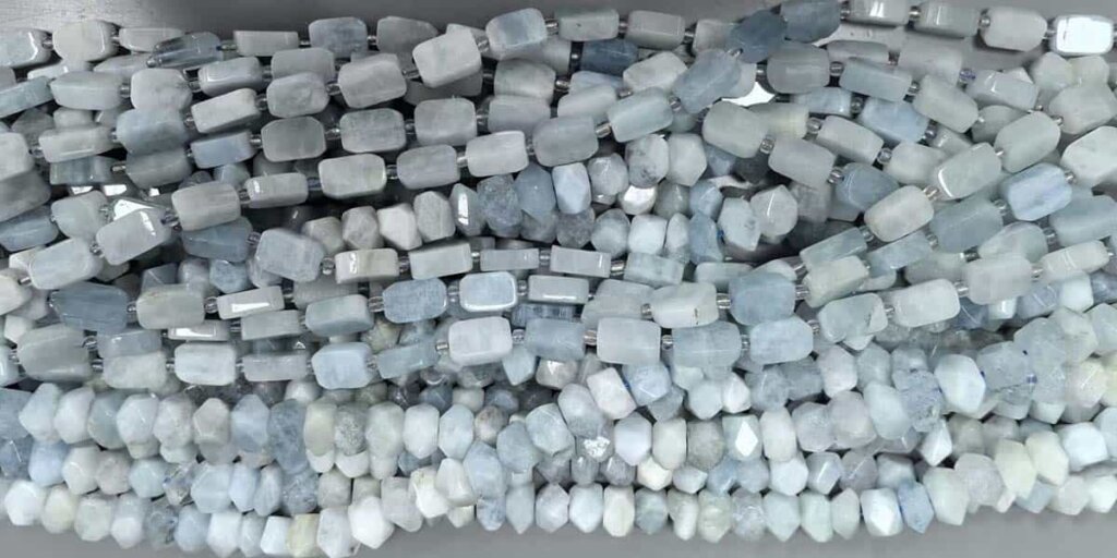 Aquamarine Stone Benefits displayed in natural gemstone pieces for emotional healing and protection