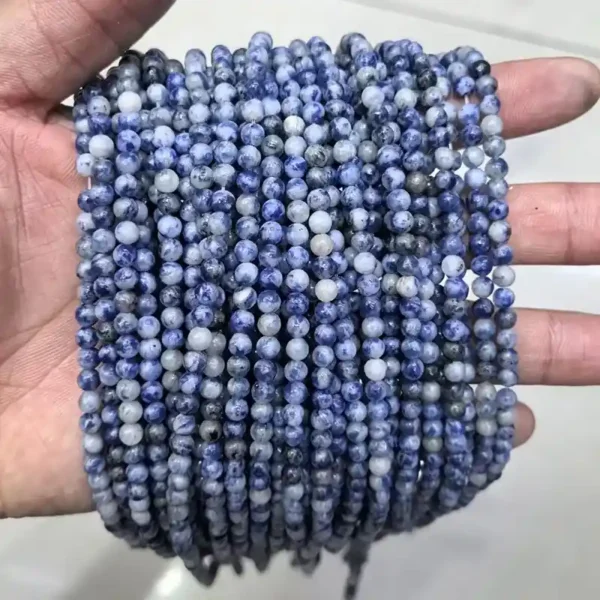 4mm Sodalite Beads in hand – small natural gemstone beads for dainty bracelet designs