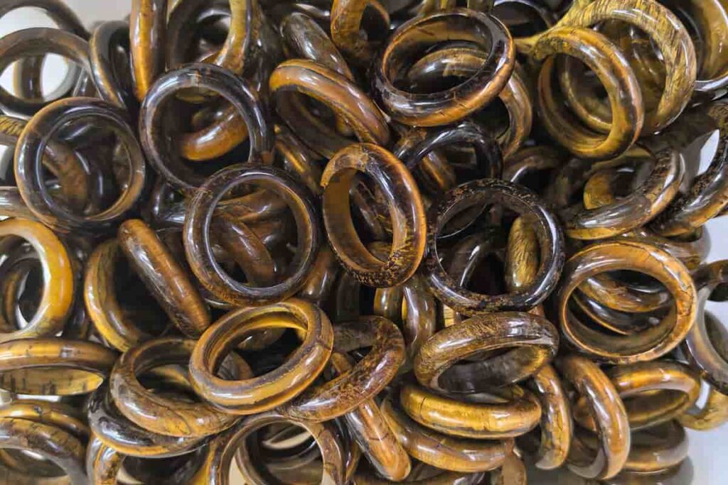 Tiger Eye Benefits shown in natural polished tiger eye rings symbolizing courage and protection