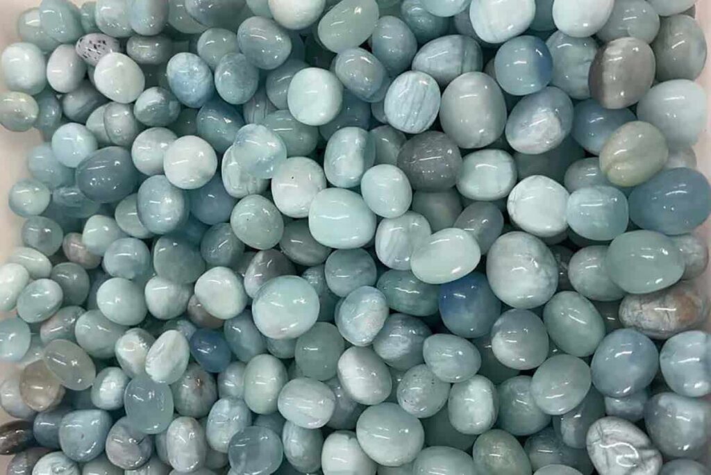Aquamarine Stone Benefits with polished tumbled stone for healing and stress relief