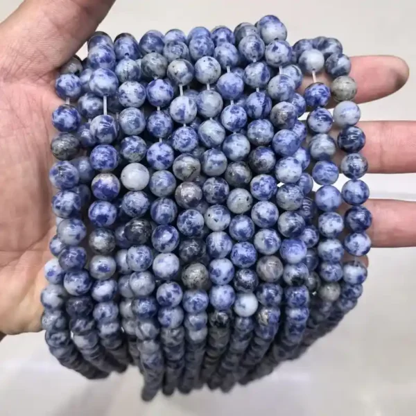 8mm Sodalite Beads in hand – the most popular size for gemstone bead bracelets