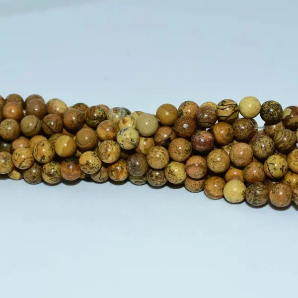 Strands of Picture Jasper Beads in golden brown hues.