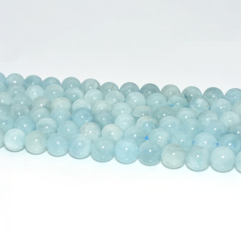 Close-up details of polished Aquamarine Beads showing clarity and smooth texture