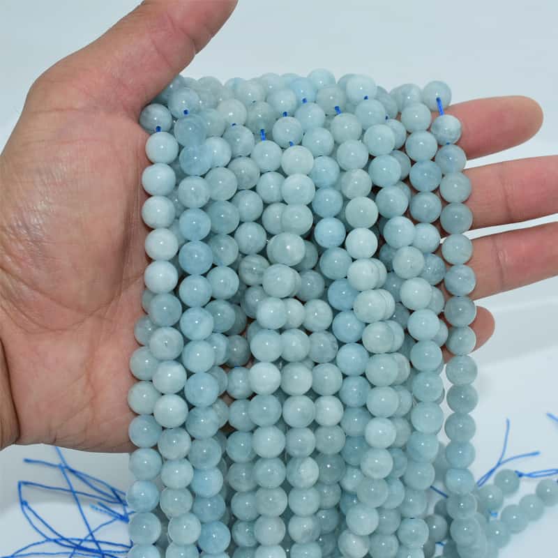 Aquamarine Beads displayed on hand to show real color and size effect