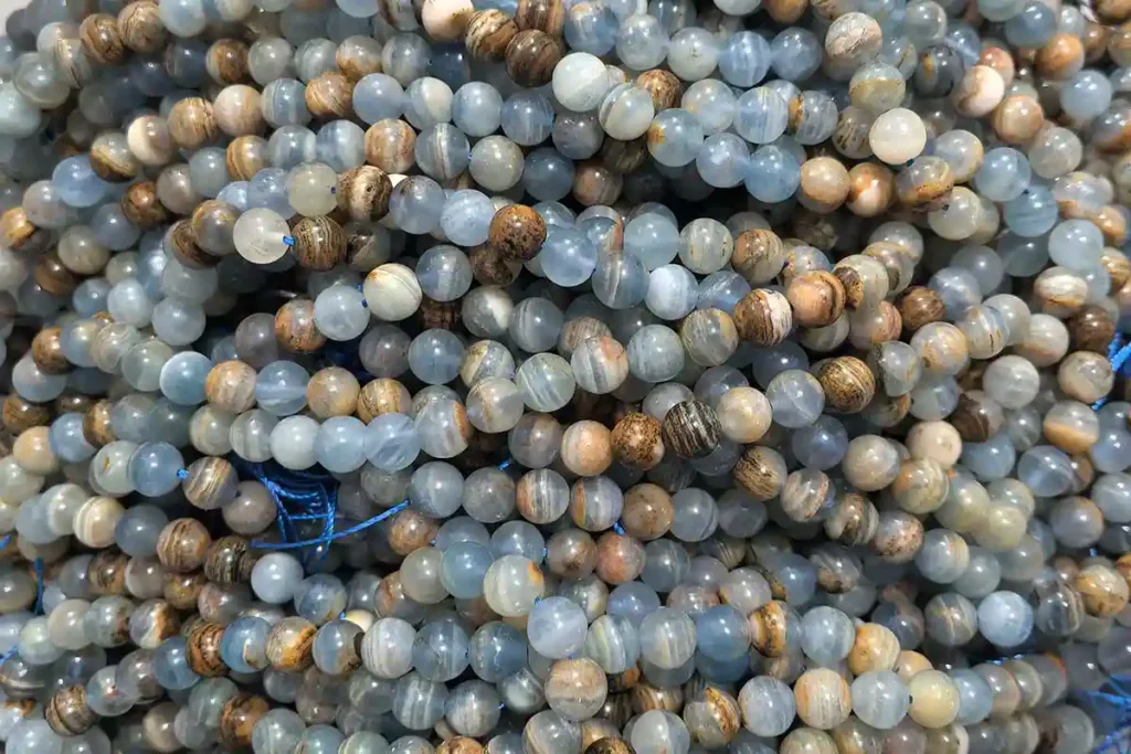 Blue Calcite Meaning – 8mm Loose Strand Beads showing the calming blue tones and spiritual energy of Blue Calcite crystals.