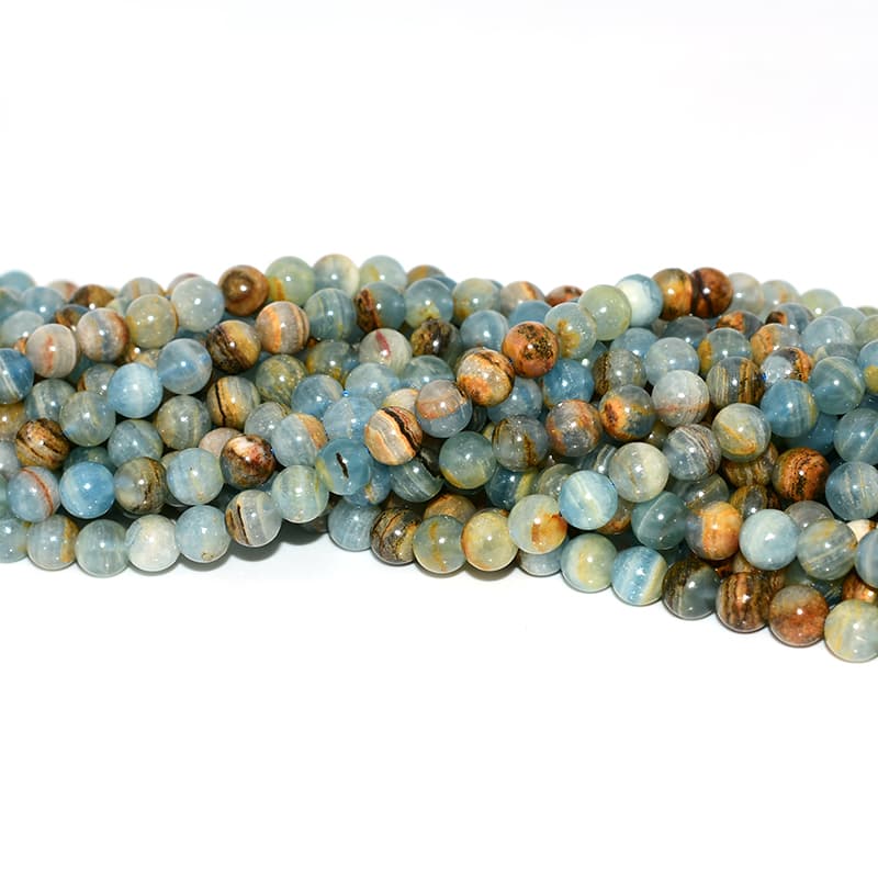 Close-up details of natural Blue Calcite Beads showing texture and color variations