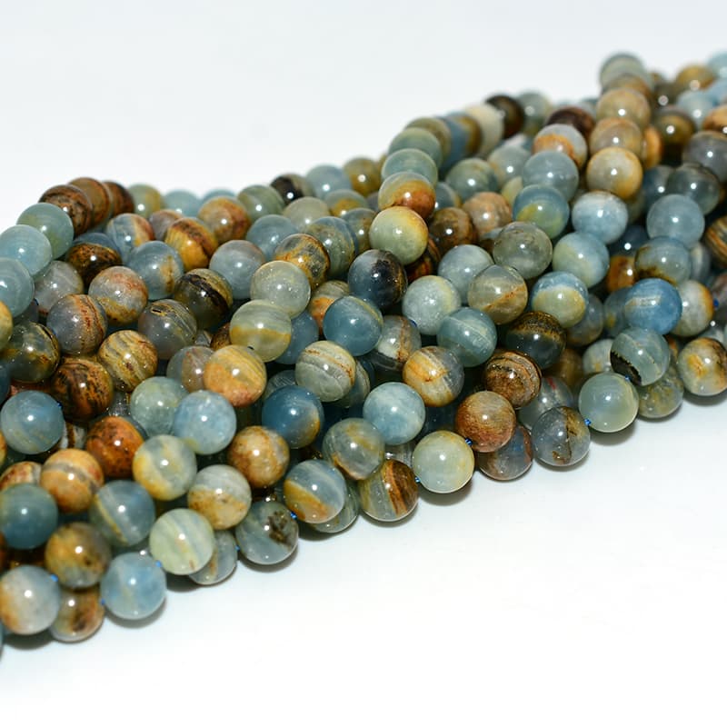 Blue Calcite Beads viewed from different angles highlighting natural polish and shine