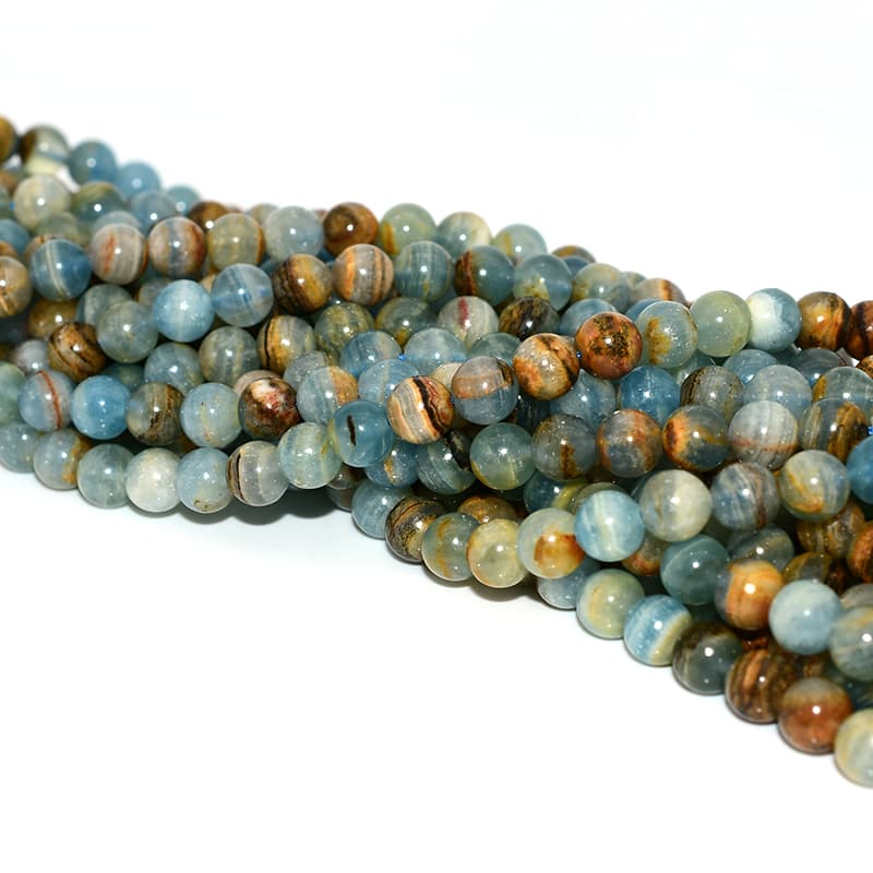 Top view of Blue Calcite Beads strands displaying uniform round shapes and blue tones