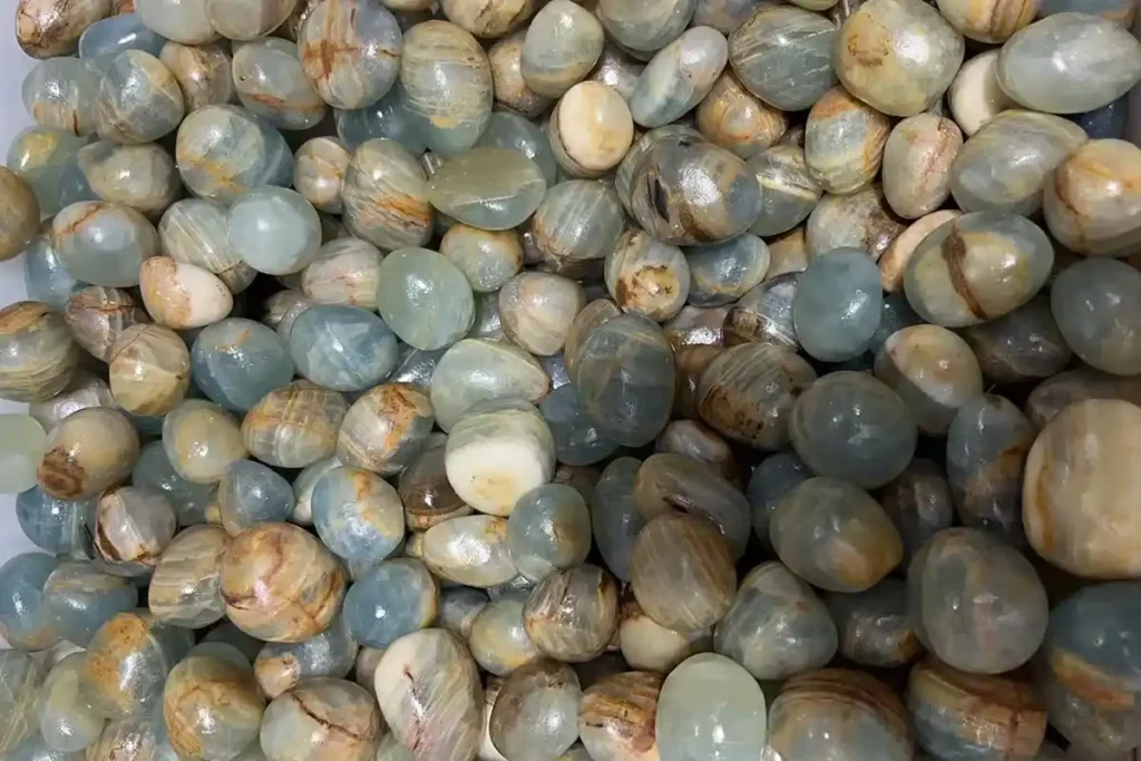 Blue Calcite Meaning – Tumbled Stones 20-30mm in box, symbolizing soothing energy and emotional balance of Blue Calcite.