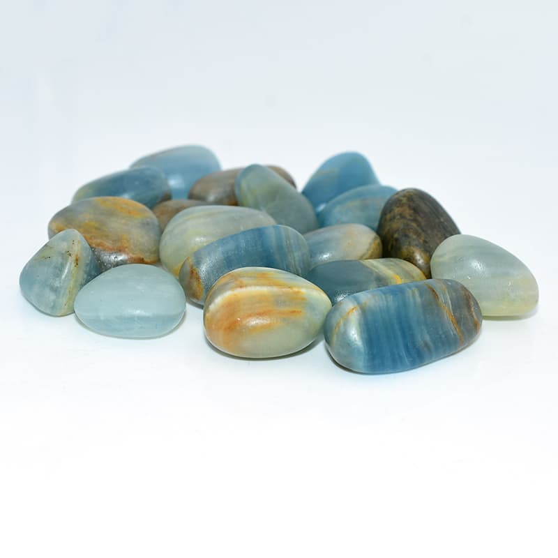 Right side detail shot of Blue Calcite Tumbled stones showing smooth surface and natural shine.