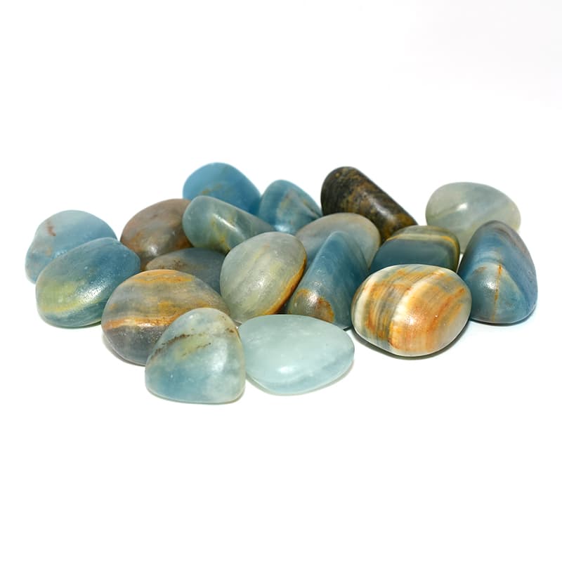 Close-up left side view of Blue Calcite Tumbled stones highlighting texture and natural brown streaks.