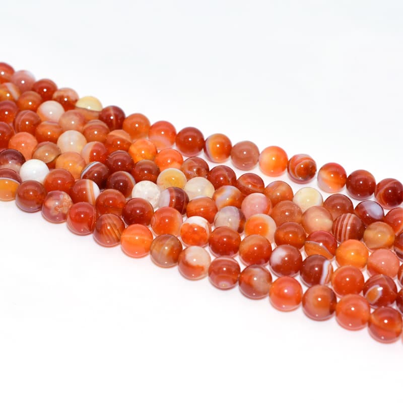 Detailed look at Carnelian Bead strand with uniform drilling