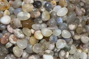 Assorted 20–30mm tumbled flower agate stones with pastel pink and cream tones, perfect for collectors and crystal shops.