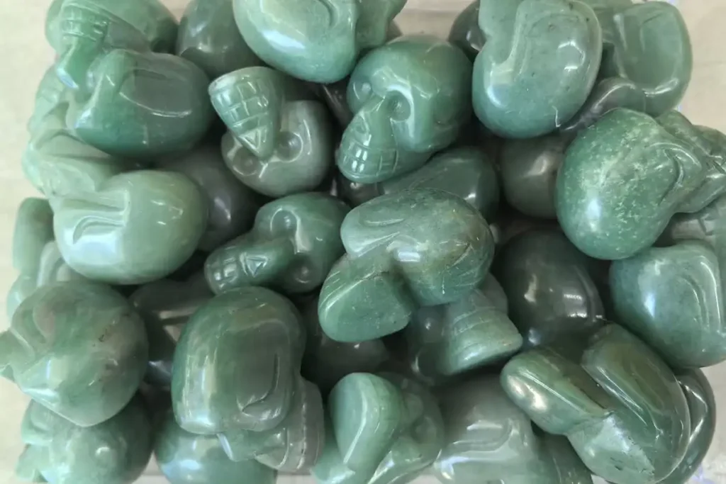 Carved skull crystal showing Green Aventurine Benefits of clarity, grounding, and good fortune.