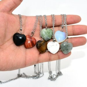Heart Stone Necklace display on hand with assorted gemstone pendants