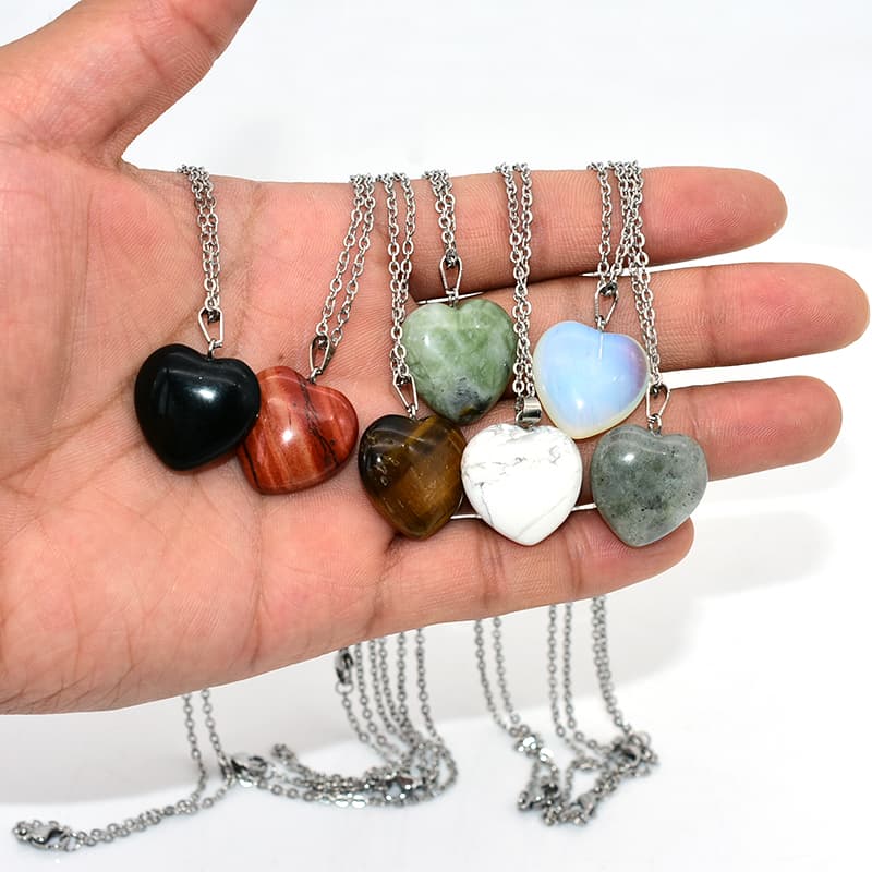 Heart Stone Necklace on hand showing multiple natural gemstone colors