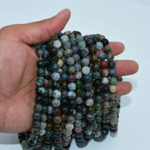 Indian Agate Beads on hand showing size, texture, and natural earthy color mix