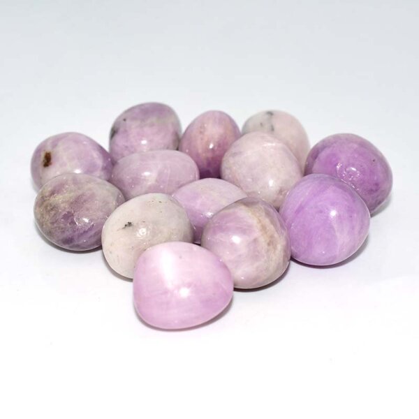 kunzite tumbled stone close-up showing lilac pink crystal details
