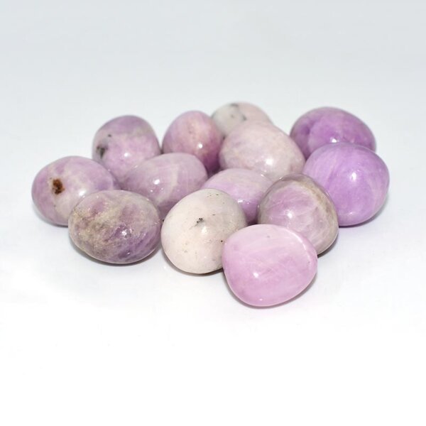 kunzite tumbled stone side view showing smooth polished surface