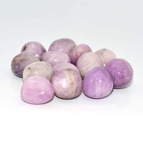 kunzite tumbled stone third angle showing soft pink and violet hues