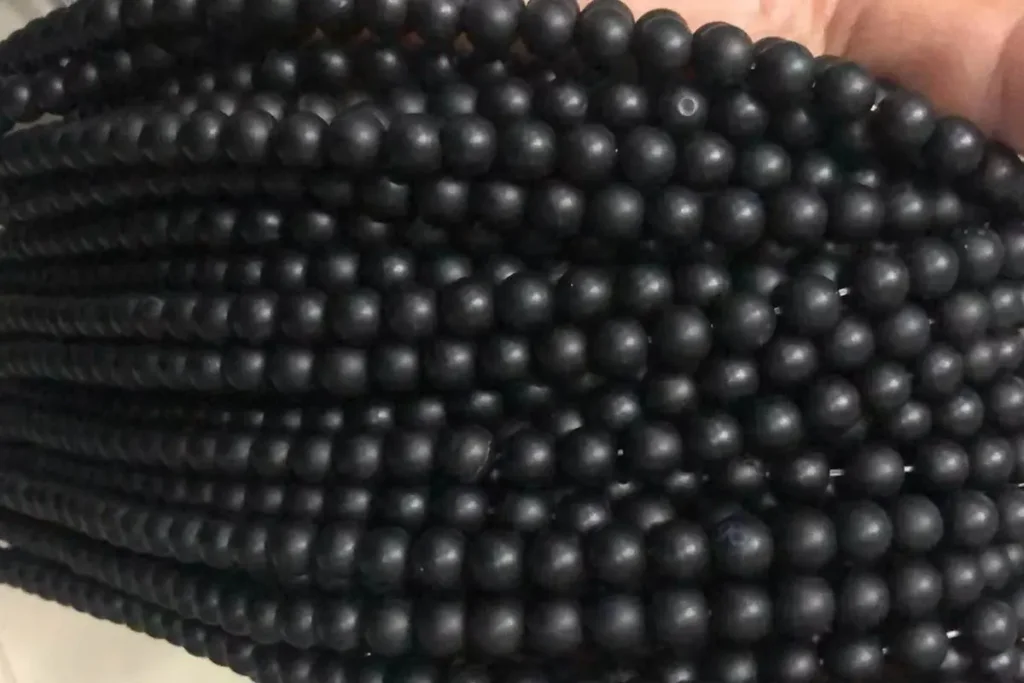 Matte Black Onyx 8mm beads with smooth finish — ideal for handmade jewelry and protective energy, emphasizing the Black Onyx Benefits.