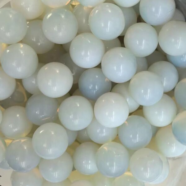 Opalite 20mm Gemstone Balls — Opalite gemstone balls, 20mm translucent milky blue glass-like spheres.