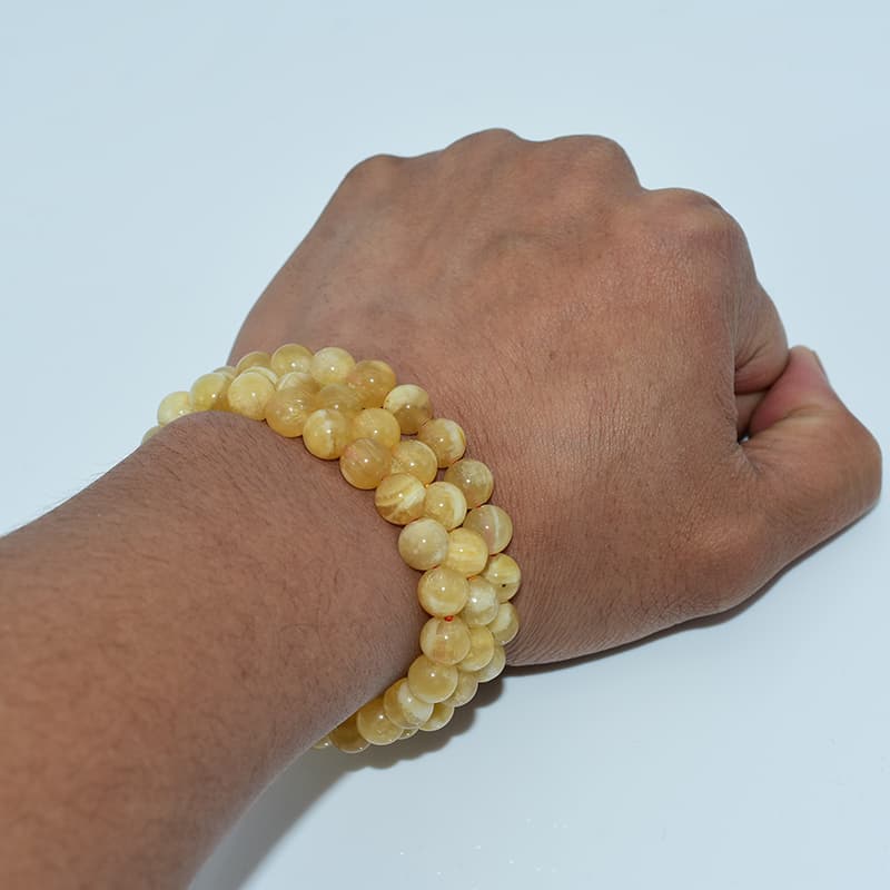 Orange Calcite Bracelet worn on wrist showing elegant fit and radiant orange hue