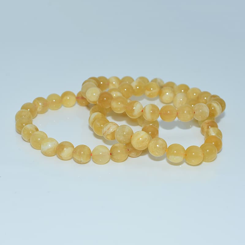 Orange Calcite Bracelet of batches displayed together highlighting color consistency