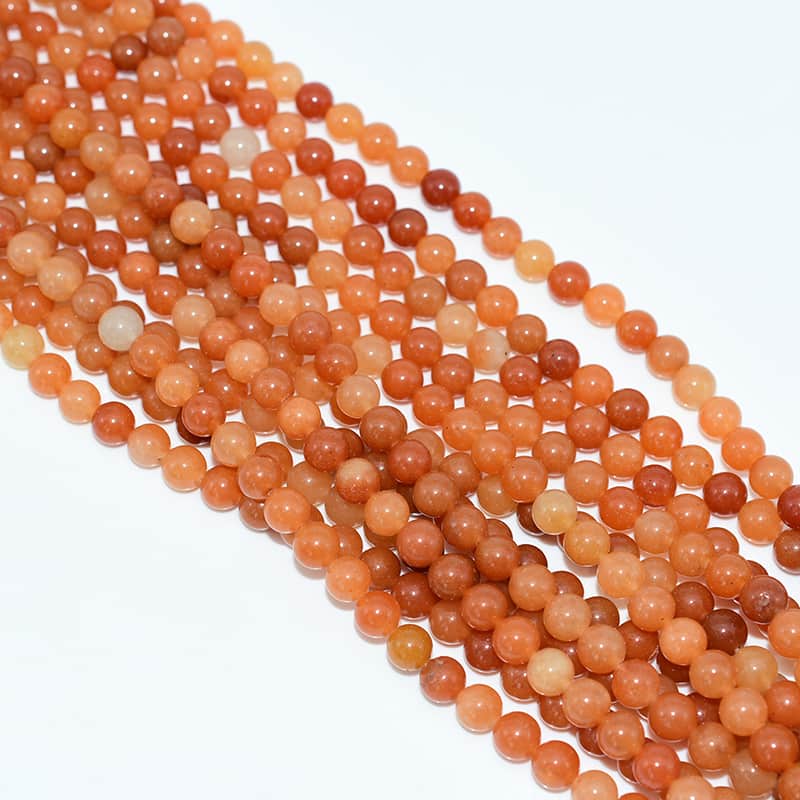 Top view of Red Aventurine Beads strands highlighting texture and color consistency
