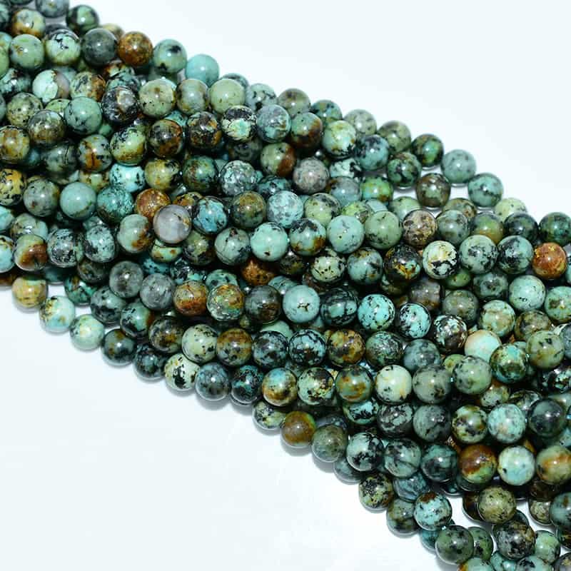 African Turquoise Beads 8mm strand close-up showing natural green-blue jasper pattern