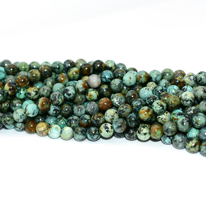 Detailed view of African Turquoise Beads with natural matrix and polished surface