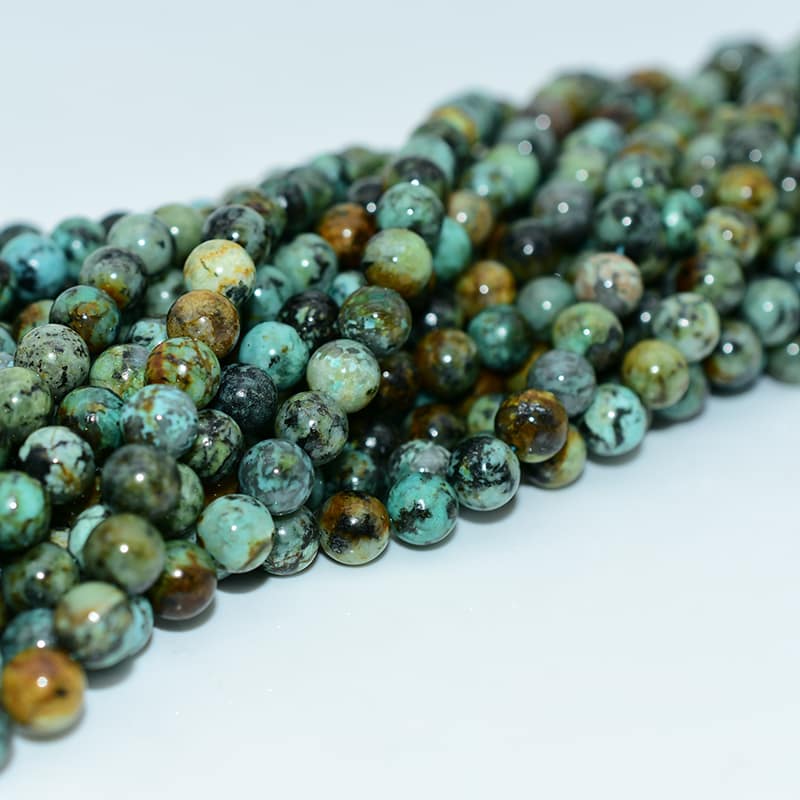 African Turquoise Beads photographed from different angle highlighting texture and color variations