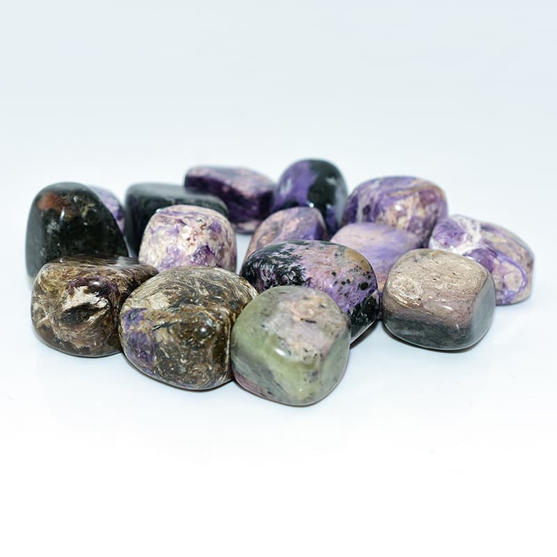 Close-up details of Charoite Tumble stones showing natural purple patterns and polished texture