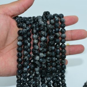 Larvikite Beads on hand showing real size