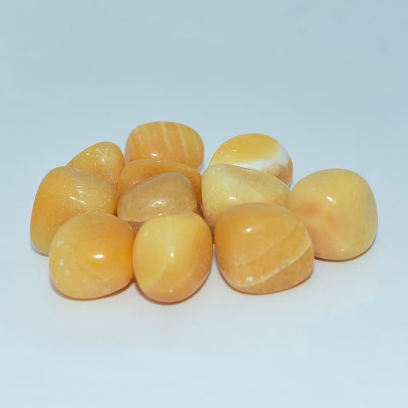 Detailed view of Orange Calcite Tumble surface and color patterns