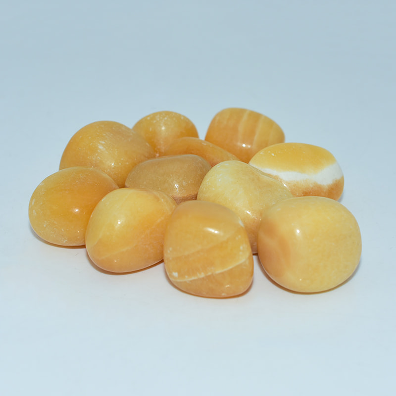 Orange Calcite Tumble bulk stones ready for retail or energy use